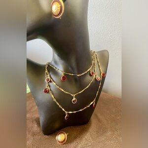 Elegant 52” Gold and ruby Red necklace in a bezel setting with clip on earrings